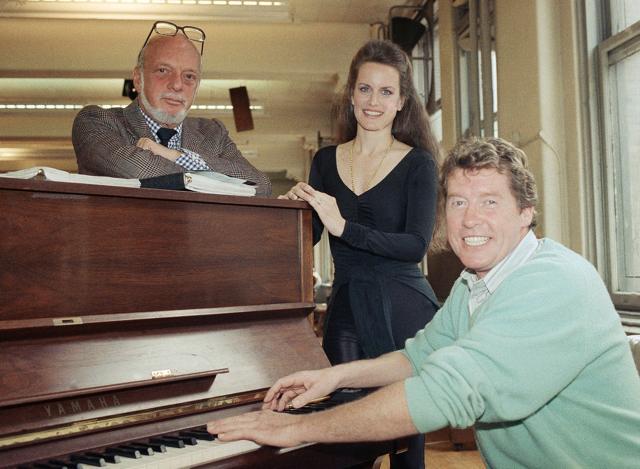 FILE - This April 24, 1989 file photo shows director Harold Prince, left, with Dale Kristien and Michael Crawford from the Los Angeles company of Andrew Lloyd Webber's "Phantom of the Opera," during a rehearsal in New York. Prince, who pushed the boundaries of musical theater with such groundbreaking shows as “The Phantom of the Oepra,” "Cabaret," "Company" and "Sweeney Todd" and won a staggering 21 Tony Awards, died Wednesday, July 31, 2019, after a brief illness in Reykjavik, Iceland. He was 91. (AP Photo/Adam Stoltman, File) (AP) FILE - This April 24, 1989 file photo shows director Harold Prince, left, with Dale Kristien and Michael Crawford from the Los Angeles company of Andrew Lloyd Webber's "Phantom of the Opera," during a rehearsal in New York. Prince, who pushed the boundaries of musical theater with such groundbreaking shows as “The Phantom of the Oepra,” "Cabaret," "Company" and "Sweeney Todd" and won a staggering 21 Tony Awards, died Wednesday, July 31, 2019, after a brief illness in Reykjavik, Iceland. He was 91. (AP Photo/Adam Stoltman, File) (AP)