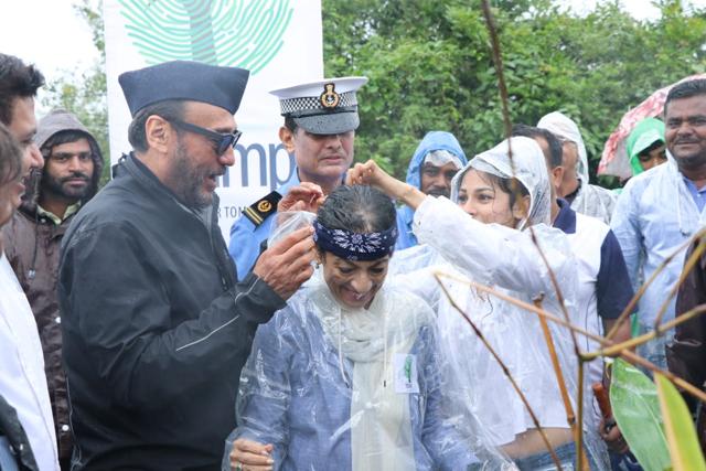 Jackie Shroff assisting Tanuja at tree-planting drive. Jackie Shroff assisting Tanuja at tree-planting drive.