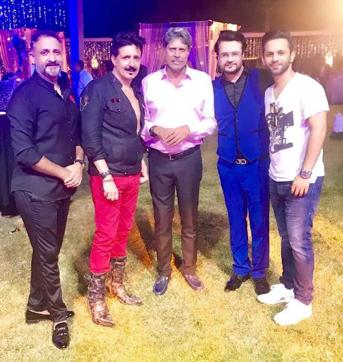 Robin Raina (second from right) and Kapil Dev (centre) with others at the party. Robin Raina (second from right) and Kapil Dev (centre) with others at the party.