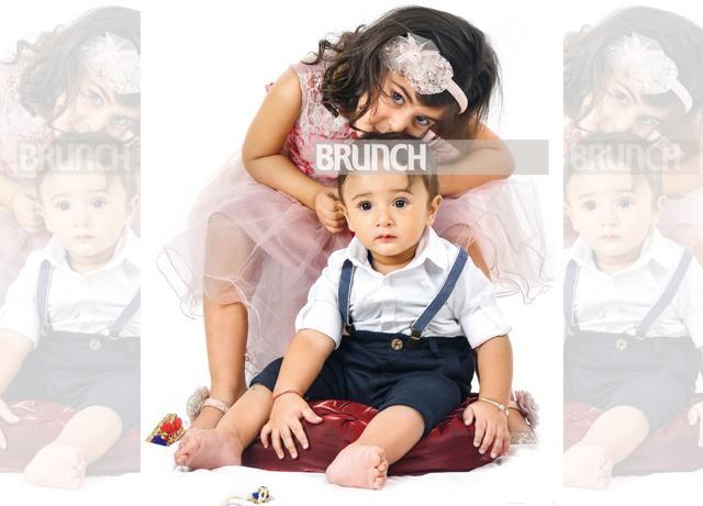 Kamna is super excited about Vishnu’s first Rakhi (On Kamna: Dress, Red Roses; shoes, Pair Point. On Vishnu: Shirt, Westside; shorts, H&M) (Raj K Raj) Kamna is super excited about Vishnu’s first Rakhi (On Kamna: Dress, Red Roses; shoes, Pair Point. On Vishnu: Shirt, Westside; shorts, H&M) (Raj K Raj)