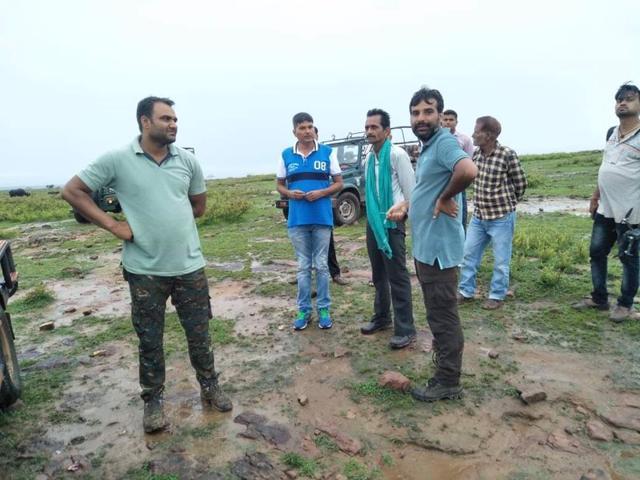 The forest team while tracking the straying Ranthambore tiger in Karauli district on Wednesday. (HT Photo )