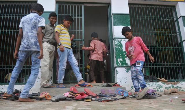 Most of the students in this primary school were spotted wearing worn out chappals. Only a handful of students were wearing shoes. (HT photo) Most of the students in this primary school were spotted wearing worn out chappals. Only a handful of students were wearing shoes. (HT photo)