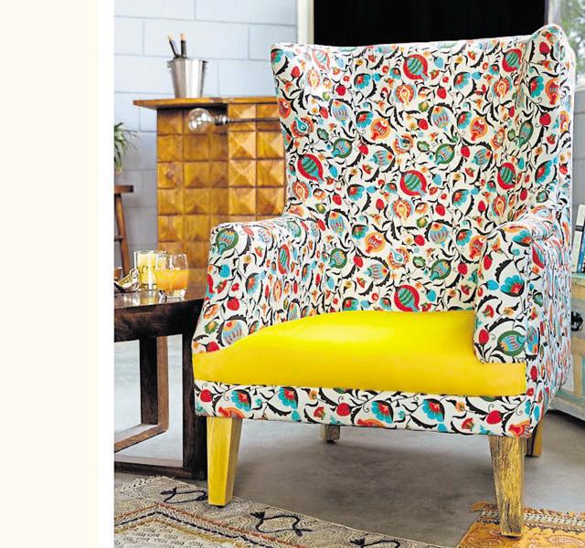 This floral printed arm chair can be pepped up with plain cushions and a rug. (Chumbak) This floral printed arm chair can be pepped up with plain cushions and a rug. (Chumbak)