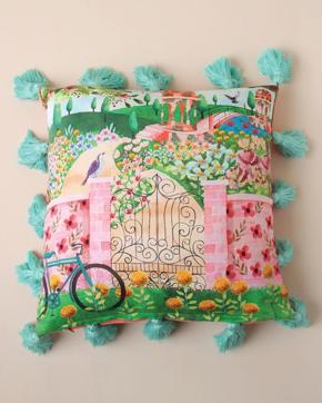 This cotton cushion cover with fun tassels and enchanted garden print will brighten up your bed linen. (Chumbak) This cotton cushion cover with fun tassels and enchanted garden print will brighten up your bed linen. (Chumbak)
