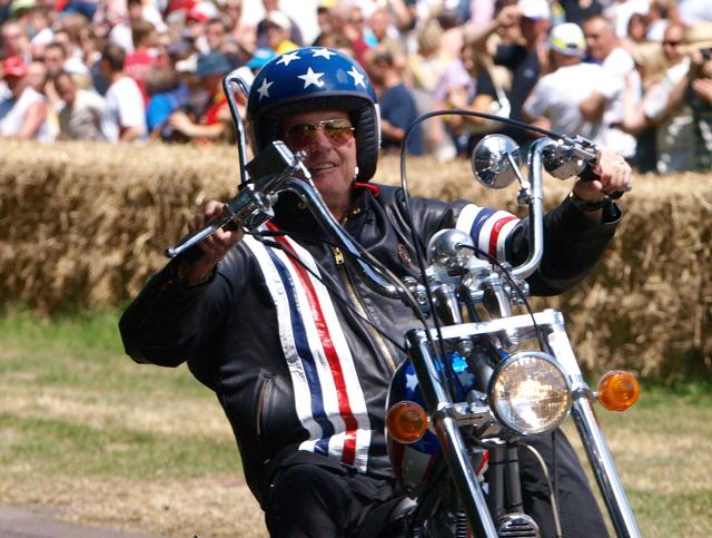 Peter Fonda drives past the crowd on the replica of the motocycle he was riding in the 1969 film, Easy-rider, at Goodwood's Festival of Speed in Goodwood, Southern England. (AFP) Peter Fonda drives past the crowd on the replica of the motocycle he was riding in the 1969 film, Easy-rider, at Goodwood's Festival of Speed in Goodwood, Southern England. (AFP)