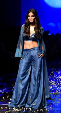 Malavika Mohanan presents a creation by designer Vineet Trahul during a fashion show at Lakme Fashion Week (LFW) Winter Festive 2019 in Mumbai on August 21. (AFP)