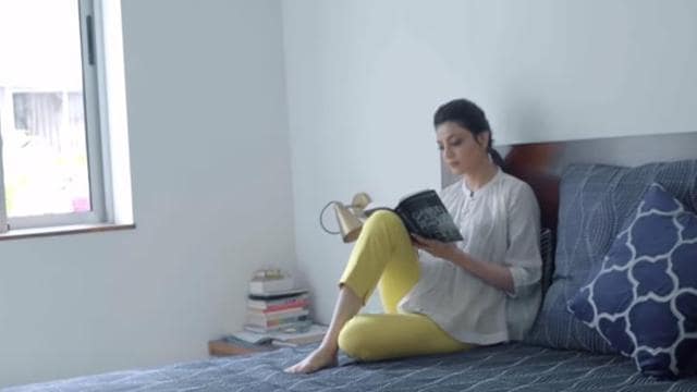Kajol enjoys reading on her simple, floating bed. Kajol enjoys reading on her simple, floating bed.
