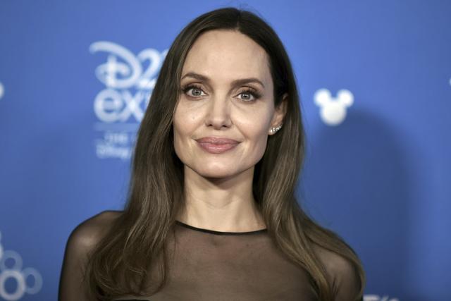 Angelina Jolie attends the Go Behind the Scenes with the Walt Disney Studios, press line at the 2019 D23 Expo. (Richard Shotwell/Invision/AP) Angelina Jolie attends the Go Behind the Scenes with the Walt Disney Studios, press line at the 2019 D23 Expo. (Richard Shotwell/Invision/AP)