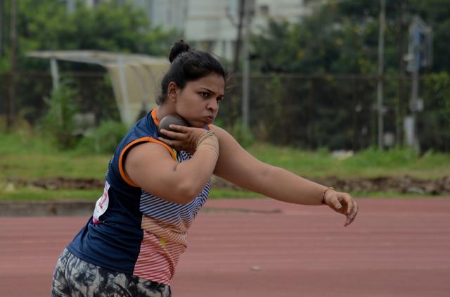 Anushka Deshpande from Pune in action during the girls shot put event. (Milind Saurkar/HT Photo)
