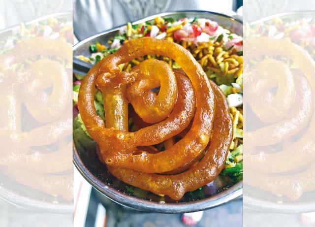 A classic breakfast in Bhopal would be biting into jalebi and topping it with a spoon of poha (Vir Sanghvi)