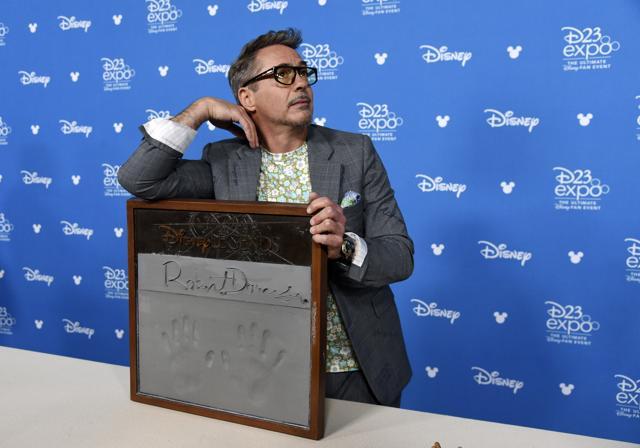 Actor Robert Downey Jr. strikes a pose during his handprint ceremony at the Disney Legends press line during the 2019 D23 Expo. (Chris Pizzello/Invision/AP) Actor Robert Downey Jr. strikes a pose during his handprint ceremony at the Disney Legends press line during the 2019 D23 Expo. (Chris Pizzello/Invision/AP)