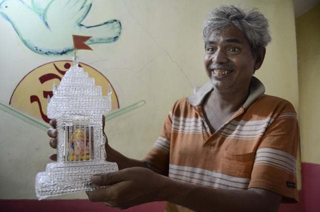 Mukund Gadre shows us a handcrafted glass temple, which is priced at Rs 5,000. (Ravindra Joshi/HT PHOTO) Mukund Gadre shows us a handcrafted glass temple, which is priced at Rs 5,000. (Ravindra Joshi/HT PHOTO)