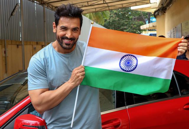 John Abraham holds a Tricolour as he poses for a photograph during Independence Day celebration, in Mumbai, Wednesday, Aug 14, 2019. (PTI) John Abraham holds a Tricolour as he poses for a photograph during Independence Day celebration, in Mumbai, Wednesday, Aug 14, 2019. (PTI)
