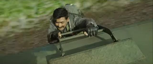 Suriya in an action sequence. Suriya in an action sequence.