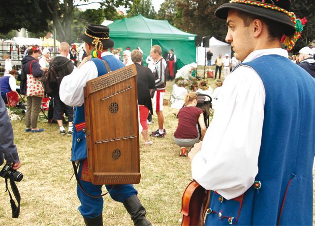Musicians from south Poland carry their instruments after a day’s work Musicians from south Poland carry their instruments after a day’s work