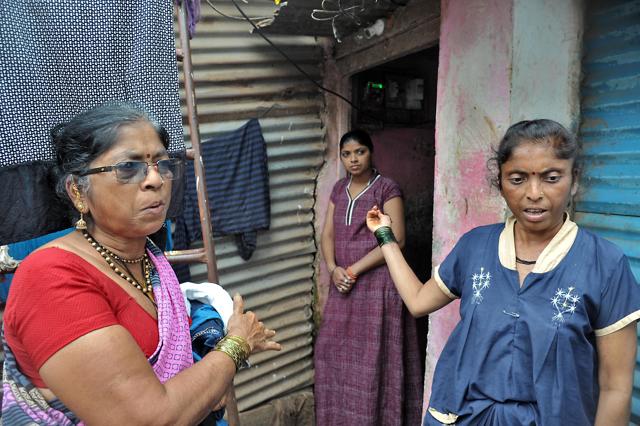 Baby Bapu Torne (left), Renuka Rani Kumbhar and Swati Rajesh Kalbhor outside their homes a month post the Sangli floods. (UDAY DEOLEKAR)