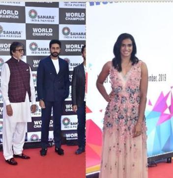 Amitabh Bachchan and Abhishek Bachchan pose at an event held to felicitate PV Sindhu (right). (Varinder Chawla) Amitabh Bachchan and Abhishek Bachchan pose at an event held to felicitate PV Sindhu (right). (Varinder Chawla)