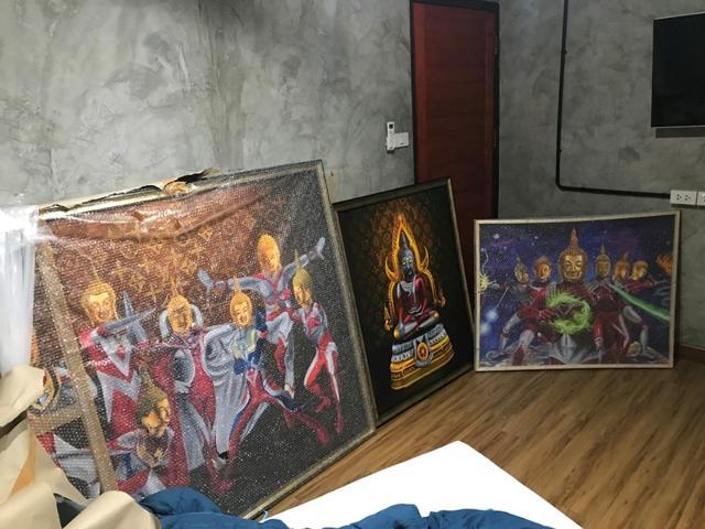 Paintings of Japanese superhero ‘Ultraman’ with Thai-style Buddha's head are seen in Bangkok. (REUTERS) Paintings of Japanese superhero ‘Ultraman’ with Thai-style Buddha's head are seen in Bangkok. (REUTERS)