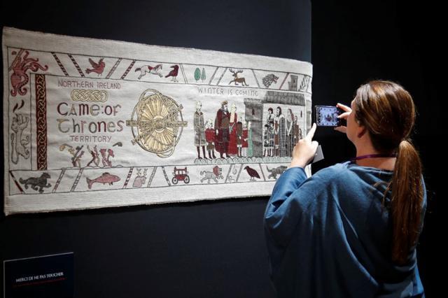 A visitor takes a picture of the Game of Thrones Tapestry in Bayeux, France, September 13, 2019. REUTERS/Charles Platiau (RUETERS) A visitor takes a picture of the Game of Thrones Tapestry in Bayeux, France, September 13, 2019. REUTERS/Charles Platiau (RUETERS)