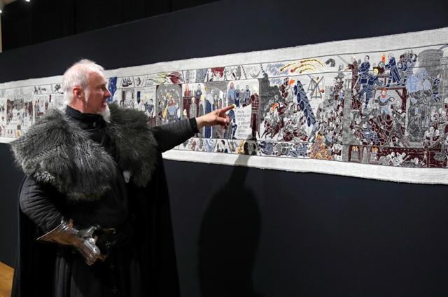 Guide William Van Der Kells of Winterfell Tours points at the Game of Thrones Tapestry in Bayeux, France, September 13, 2019. REUTERS/Charles Platiau (RUETERS) Guide William Van Der Kells of Winterfell Tours points at the Game of Thrones Tapestry in Bayeux, France, September 13, 2019. REUTERS/Charles Platiau (RUETERS)