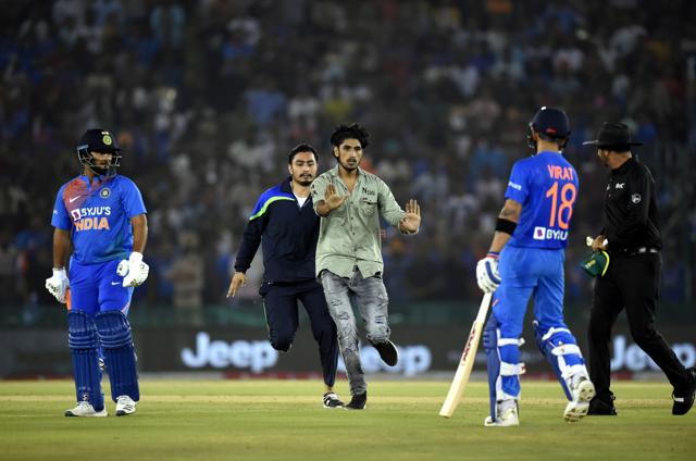 A fan tries to run towards the pitch. (PTI) A fan tries to run towards the pitch. (PTI)