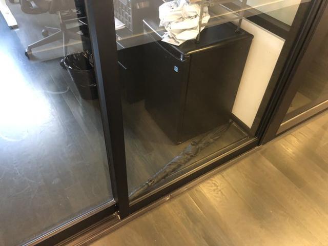 The umbrella fell down and jammed the door from inside. The umbrella fell down and jammed the door from inside.