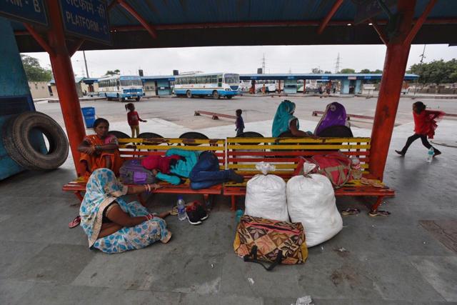 Commuters wait for a bus (Burhaan Kinu/HT photo) Commuters wait for a bus (Burhaan Kinu/HT photo)