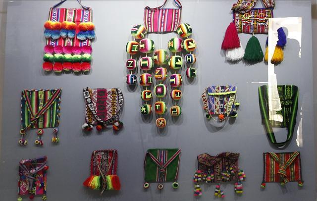 In this Sept. 13, 2019 photo, indigenous handmade bags that were given as gifts to Bolivia's President Eva Morales, are displayed at the Democratic and Cultural Revolution Museum in Orinoca, Bolivia. The museum contrasts with the humble village of Orinoca, with its farmers, llama shepherds and a population of less than 1,000 people. Poverty is visible along its cobbled streets and adobe houses. Only a few streets are paved, and many homes lack potable water and sewage systems. (AP Photo/Juan Karita) (AP) In this Sept. 13, 2019 photo, indigenous handmade bags that were given as gifts to Bolivia's President Eva Morales, are displayed at the Democratic and Cultural Revolution Museum in Orinoca, Bolivia. The museum contrasts with the humble village of Orinoca, with its farmers, llama shepherds and a population of less than 1,000 people. Poverty is visible along its cobbled streets and adobe houses. Only a few streets are paved, and many homes lack potable water and sewage systems. (AP Photo/Juan Karita) (AP)