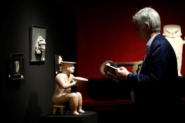 A female statue showing a dignitary, one of pre-Columbian artefacts, is presented to the press at Drouot auction house in Paris. (REUTERS) A female statue showing a dignitary, one of pre-Columbian artefacts, is presented to the press at Drouot auction house in Paris. (REUTERS)