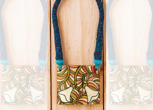 A Kerala mural art bamboo necklace that’s been hand painted A Kerala mural art bamboo necklace that’s been hand painted