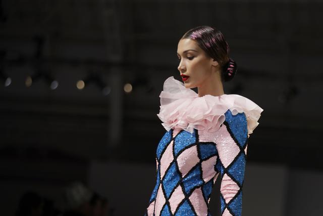 Model Bella Hadid wears a creation as part of the Moschino Spring-Summer 2020 collection, unveiled during the fashion week, in Milan, Italy, Thursday, Sept. 19, 2019. (AP Photo/Luca Bruno) (AP) Model Bella Hadid wears a creation as part of the Moschino Spring-Summer 2020 collection, unveiled during the fashion week, in Milan, Italy, Thursday, Sept. 19, 2019. (AP Photo/Luca Bruno) (AP)