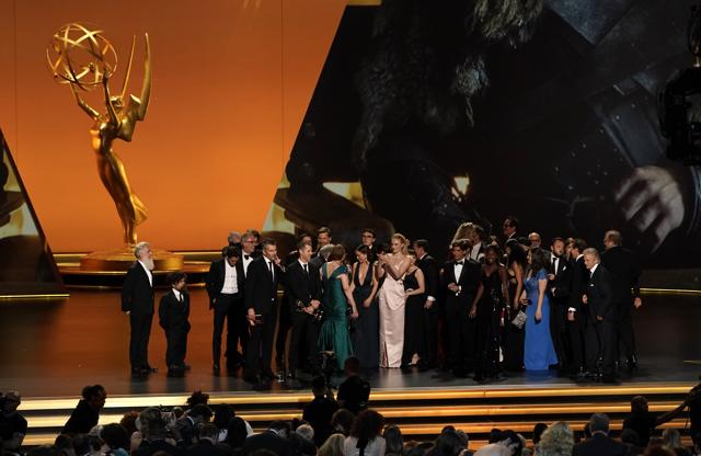 Cast and crew of Game of Thrones, winners of the award for Outstanding  Writing for a Drama Series, appear backstage during the 70th annual  Primetime Emmy Awards at the Microsoft Theater in