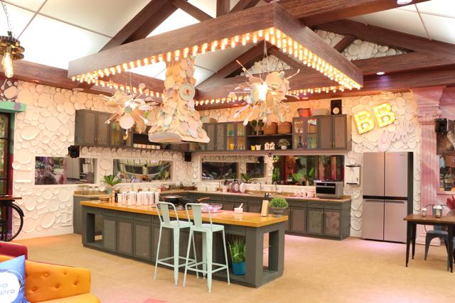 The Bigg Boss 13 kitchen is decorated with cups and plates.