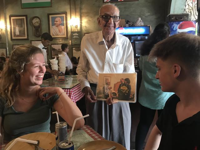 Boman Kohinoor showing a pic of his meeting Prince William and Kate to Aliya and Zak Kapoor. (Karan Kapoor) Boman Kohinoor showing a pic of his meeting Prince William and Kate to Aliya and Zak Kapoor. (Karan Kapoor)
