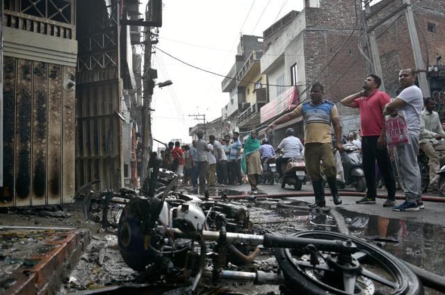 The fire also destroyed two scooters and a bike parked outside the building. (Gurpreet Singh/HT)