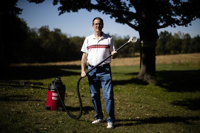 A man armed with wet/dry vac to deal with the swarms of lanternflies. (AP) A man armed with wet/dry vac to deal with the swarms of lanternflies. (AP)