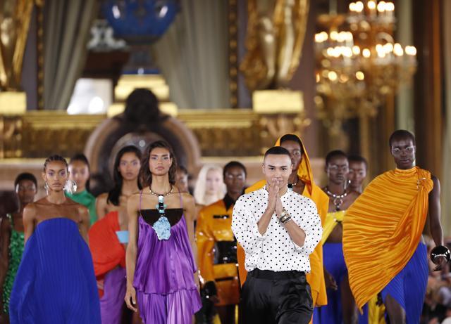 Designer Olivier Rousteing, center right, accepts applause at the conclusion of the Balmain Ready To Wear Spring-Summer 2020 collection, unveiled during the fashion week, in Paris, Friday, Sept. 27, 2019. (AP Photo/Thibault Camus) (AP) Designer Olivier Rousteing, center right, accepts applause at the conclusion of the Balmain Ready To Wear Spring-Summer 2020 collection, unveiled during the fashion week, in Paris, Friday, Sept. 27, 2019. (AP Photo/Thibault Camus) (AP)
