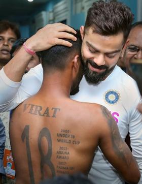 Virat Kohli hugs super fan Pintu Behra. (PTI) Virat Kohli hugs super fan Pintu Behra. (PTI)