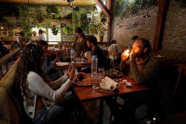 Customers smoke at Lowell Farms, America's first official Cannabis Cafe offering farm-to-table dining and smoking of cannabis in West Hollywood, (REUTERS) Customers smoke at Lowell Farms, America's first official Cannabis Cafe offering farm-to-table dining and smoking of cannabis in West Hollywood, (REUTERS)