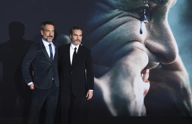 Director Todd Phillips, left, and cast member Joaquin Phoenix arrive at the Los Angeles premiere of Joker at TCL Chinese Theatre. (Jordan Strauss/Invision/AP)