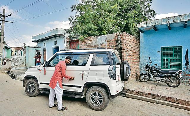 Rohi village resident Shriram, who gave up studies having failed in Class 10 board exams, has mulled several business ideas. He has recently bought a new SUV. (Biplov Bhuyan/HT) Rohi village resident Shriram, who gave up studies having failed in Class 10 board exams, has mulled several business ideas. He has recently bought a new SUV. (Biplov Bhuyan/HT)