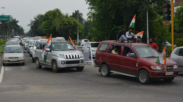 Party workers violating traffic rules during a roadshow in Panchkula on Friday. (Sant Arora/HT) Party workers violating traffic rules during a roadshow in Panchkula on Friday. (Sant Arora/HT)