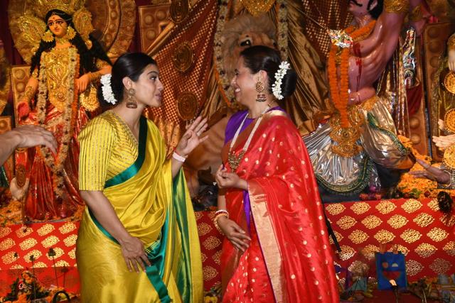 Kajol and Rani Mukerji share some light moments at the pandal. (Varinder Chawla) Kajol and Rani Mukerji share some light moments at the pandal. (Varinder Chawla)