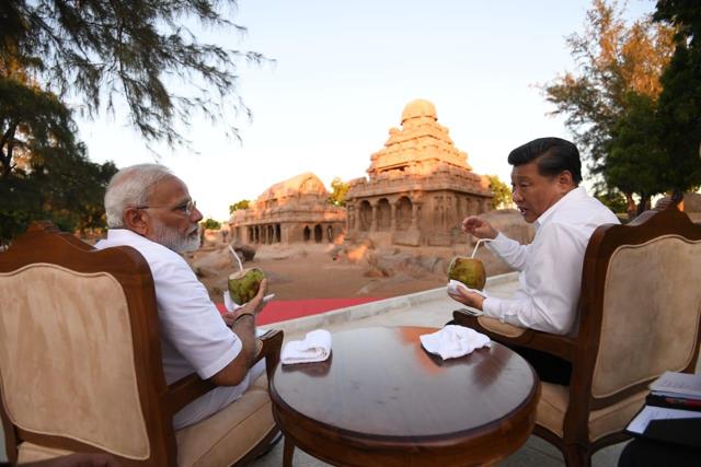 PM Narendra Modi and Chinese President Xi have a quiet conversation at the ‘five chariots’ at Mamallapuram. The monuments resemble processional chariots of a temple and are hewn out of solid rock to form five free-standing monolith temples. (Photo: MEAIndia/ Twitter) PM Narendra Modi and Chinese President Xi have a quiet conversation at the ‘five chariots’ at Mamallapuram. The monuments resemble processional chariots of a temple and are hewn out of solid rock to form five free-standing monolith temples. (Photo: MEAIndia/ Twitter)