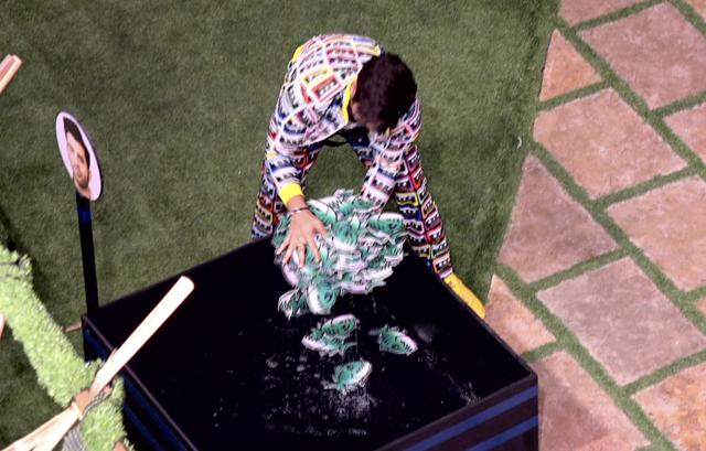 A contestant takes out fishes from the pond during the BB Fisheries task. A contestant takes out fishes from the pond during the BB Fisheries task.