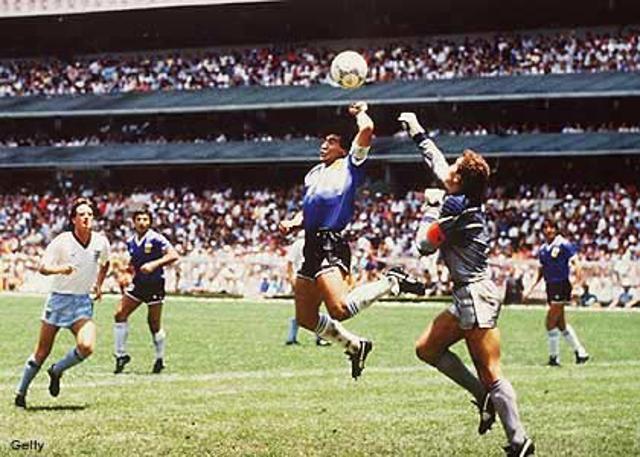 World Cup 1986 - Argentina's Diego Maradona flies past England goalkeeper Peter Shilton after using his fist to score the infamous Hand of God goal World Cup 1986 - Argentina's Diego Maradona flies past England goalkeeper Peter Shilton after using his fist to score the infamous Hand of God goal