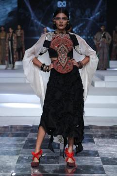 A model presents a creation by designer Anamika Khanna during the Grand Finale of Lotus Make-up IndiaFashion Week .