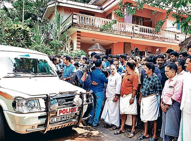 Police, media and the public at the Ponnamattam family house. (HT Photo) ( ) Police, media and the public at the Ponnamattam family house. (HT Photo) ( )