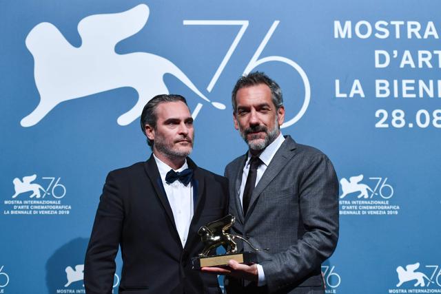 Director Todd Phillips (R) and actor Joaquin Phoenix pose with the Golden Lion award for Best Film they received for the movie Joker during the awards ceremony winners photocall of the 76th Venice Film Festival at Venice Lido. (AFP) Director Todd Phillips (R) and actor Joaquin Phoenix pose with the Golden Lion award for Best Film they received for the movie Joker during the awards ceremony winners photocall of the 76th Venice Film Festival at Venice Lido. (AFP)