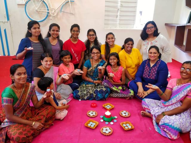 The all-women team of Mitti Ke Rang posing with diyas made by them. (HT/PHOTO)